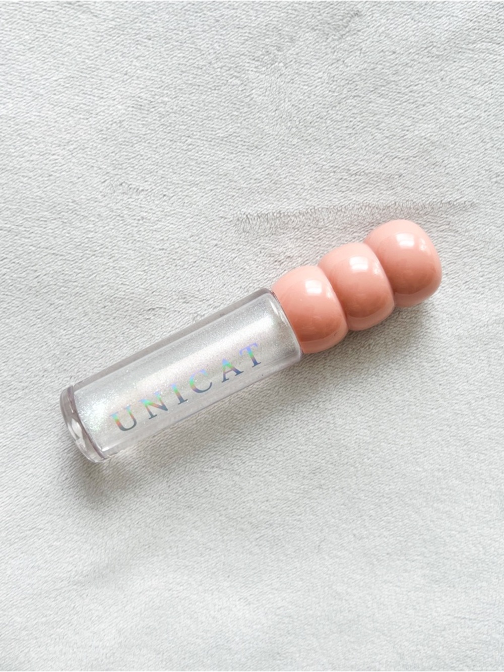 Unicat Sheer Iridescent Lip Gloss with Pale Peach Cap